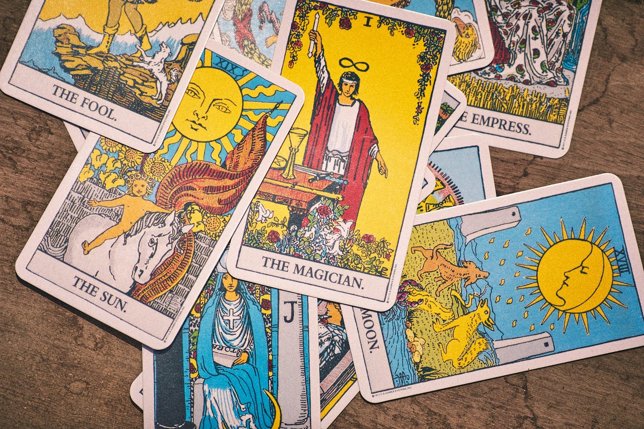 Colorful tarot cards laid out for a spiritual reading, showcasing intriguing designs.